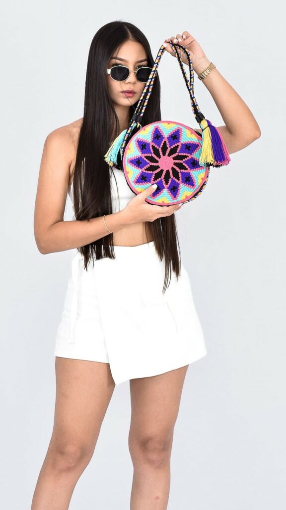 Giulia Wayuu Round Bag, handcrafted Colombian bag with purple and pink geometric motifs, handmade crochet shoulder bag.