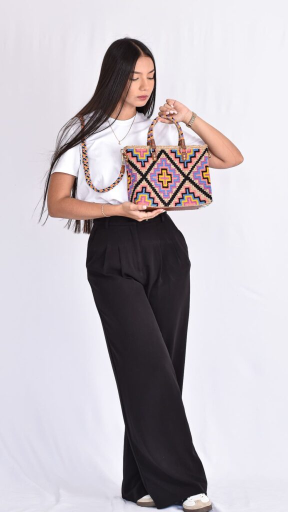 "Colorful Maye Wayuu Handbag, handmade in Colombia with yellow, blue, and purple patterns—add this Wayuu bag to your collection today.