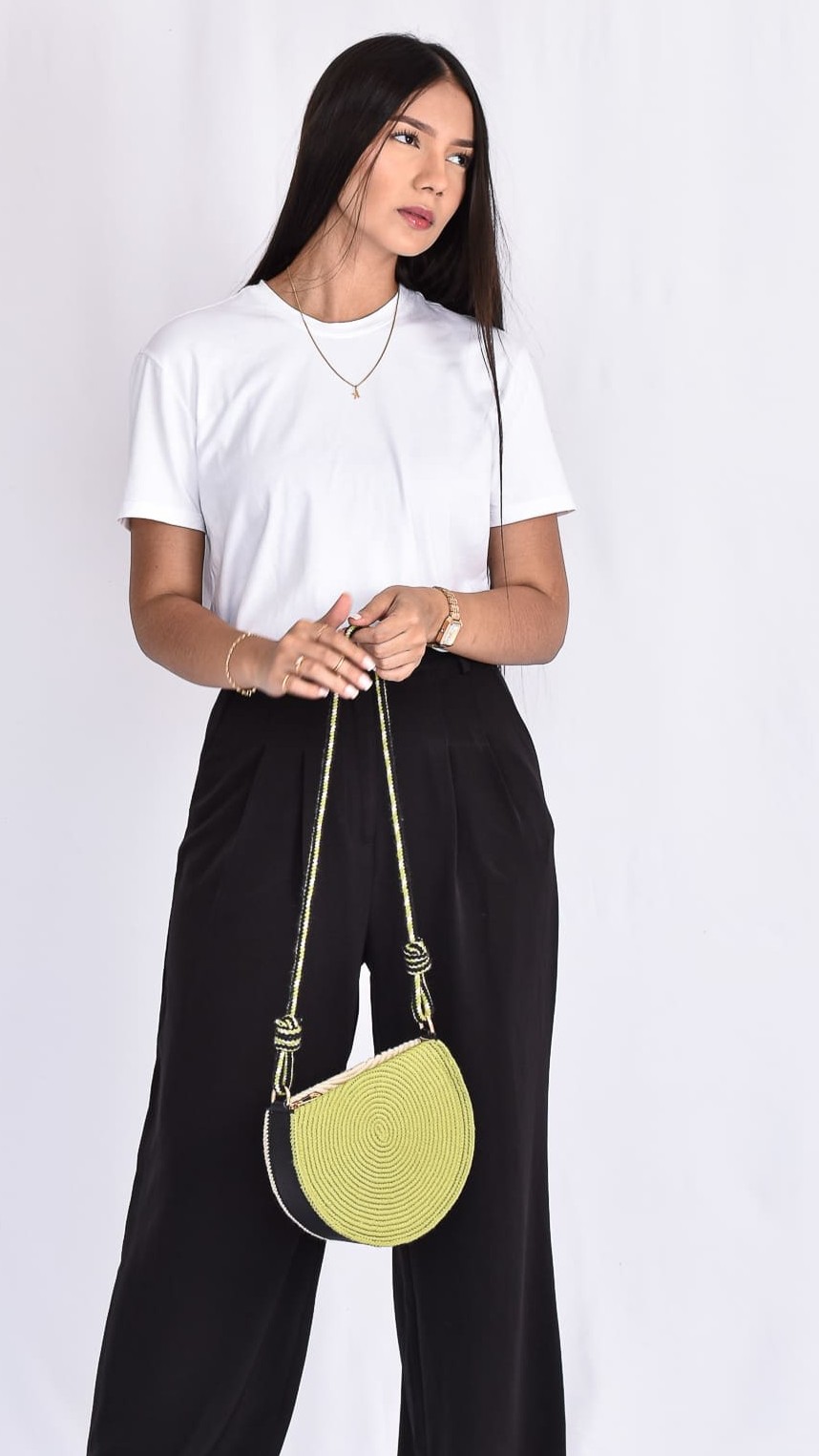 Noemi Moon Wayuu Bag, handcrafted Colombian bag with crescent shape, beige base, and green details woven by Wayuu artisans.