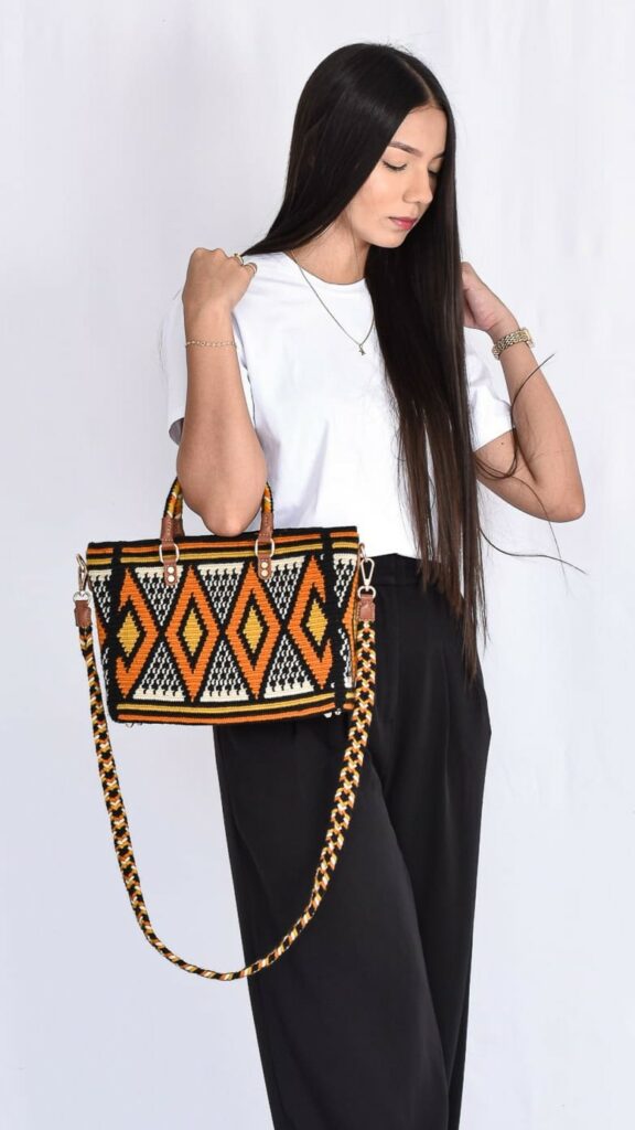 Gabrielle Wayuu Handbag, handcrafted Colombian bag with mustard, black, and beige geometric patterns, dual handles, and authentic Wayuu weaving.